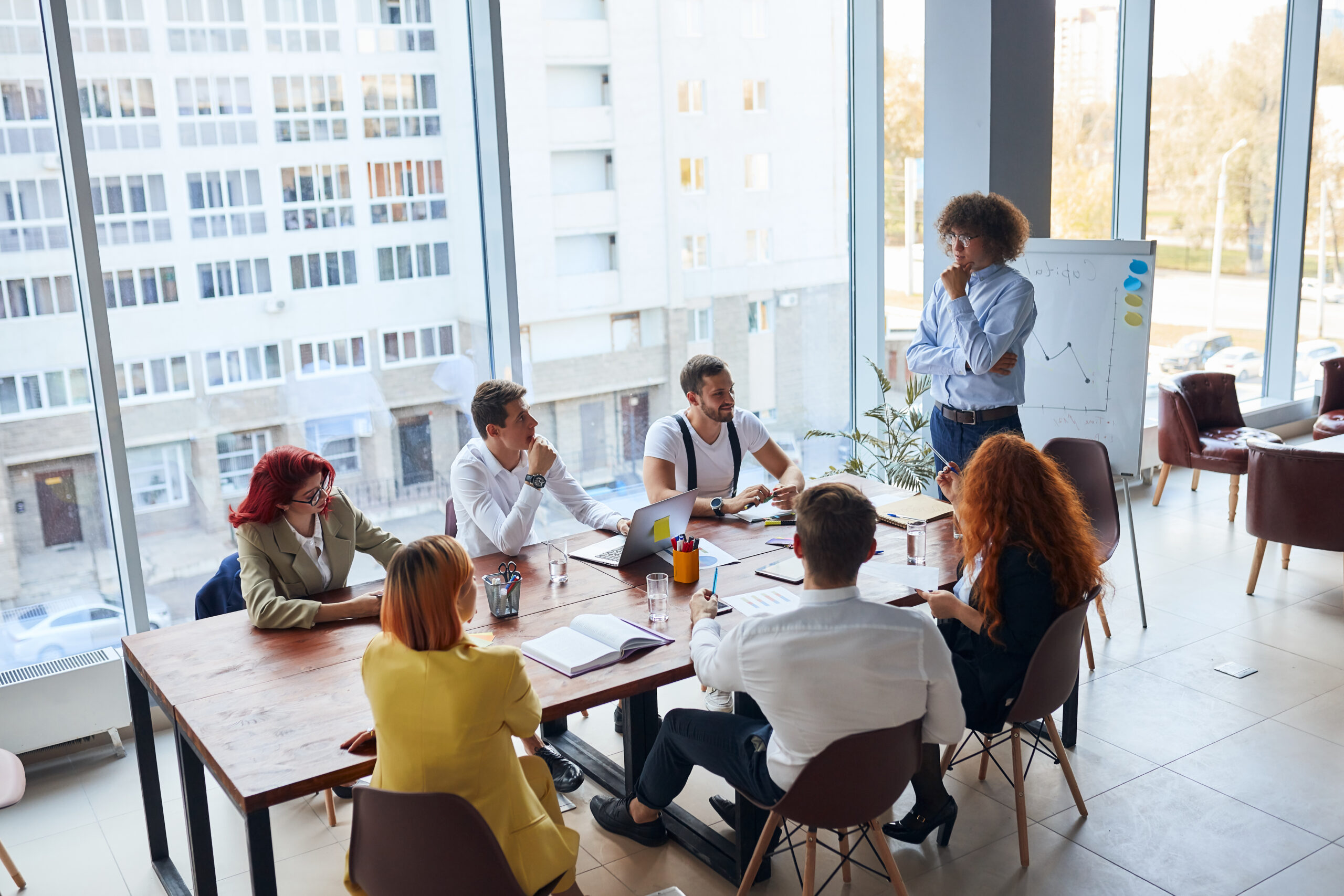 Creative,And,Enthusiastic,Business,Group,Sitting,In,Office,Together,Working