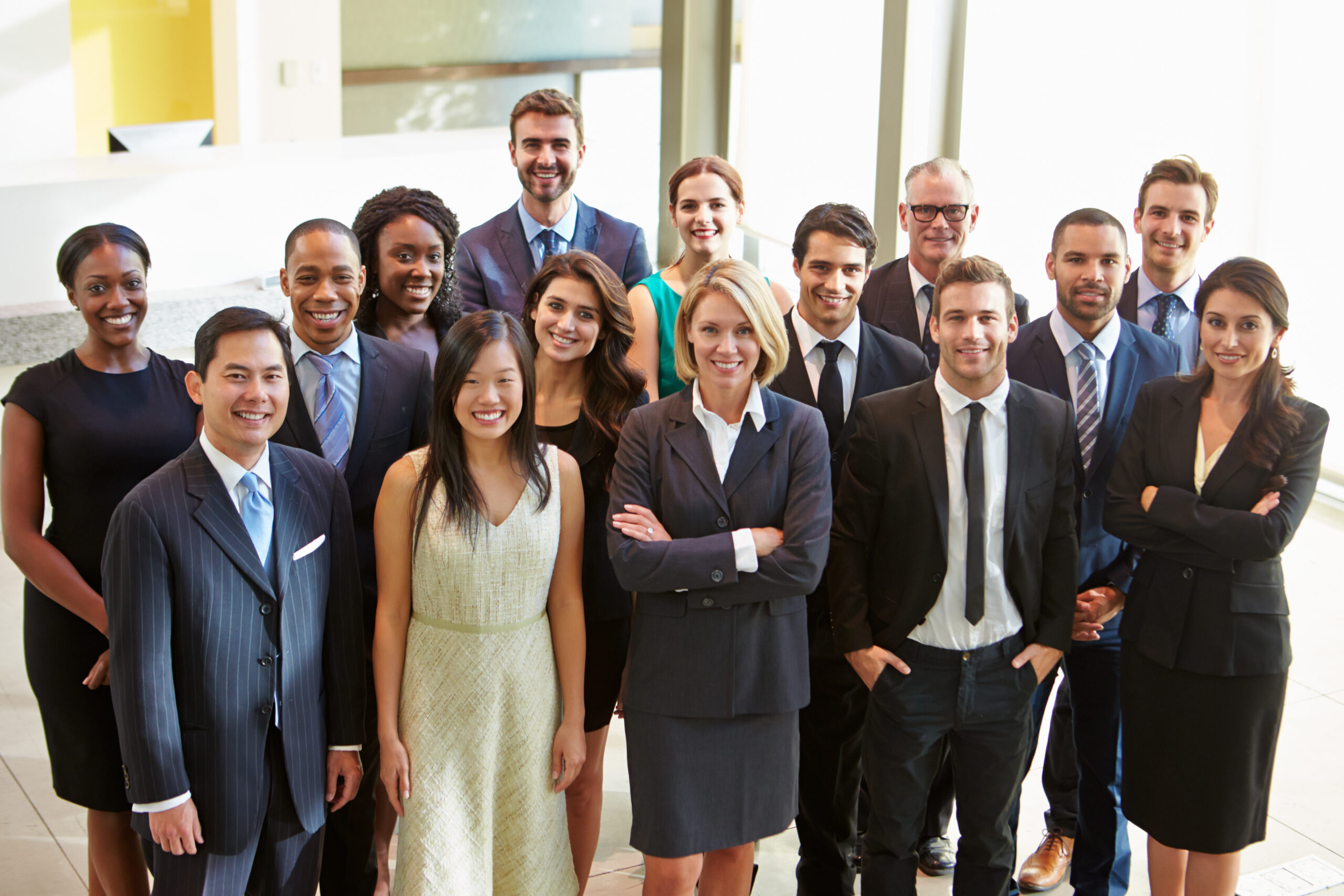 Portrait,Of,Multi-cultural,Office,Staff,Standing,In,Lobby